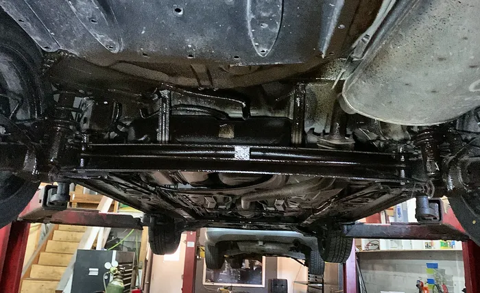 Mechanic Nation real work: Underbody rust proofing on the lift